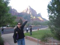 Joann points at a jagged hill in Zion National Park.jpg
