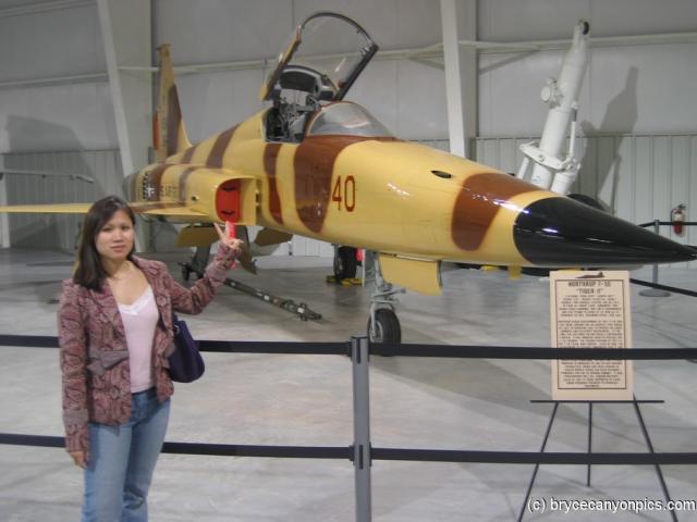 Joann stands in front of the F-5E at the Hill Aerospace Museum.jpg
