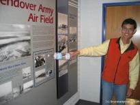 Tourguide points at a sign at the Hill Aerospace Museum.jpg