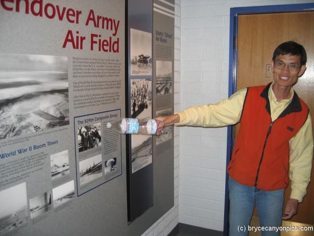Tourguide points at a sign at the Hill Aerospace Museum.jpg
